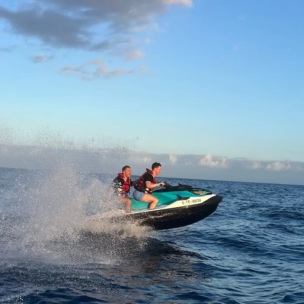 Discover-the-Ocean-Tourist-Discovery Jet ski couple driving at sunset